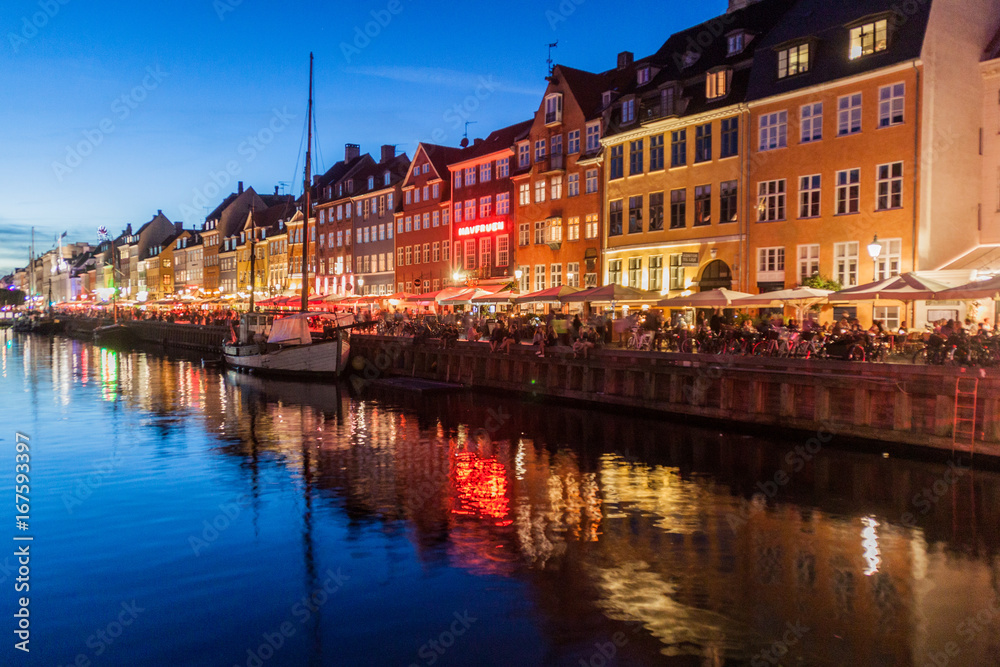 COPENHAGEN, DENMARK - AUGUST 27, 2016: Evening panorama of Nyhavn district architecture in the Old Town of Copenhagen, Denmark