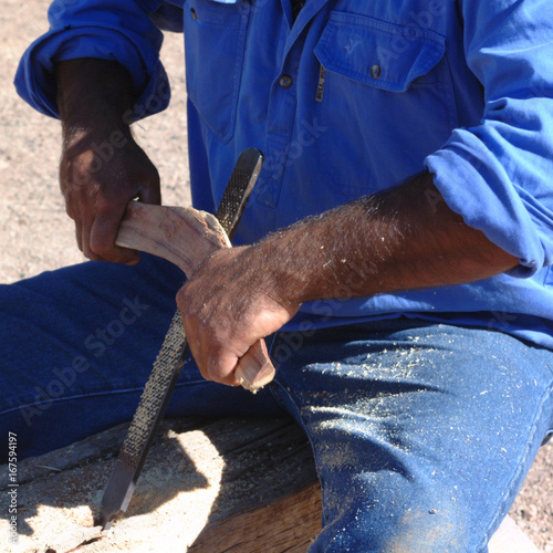 Flinders Rangers National Park, Australia - February 09, 2002: Building a boomerang photo