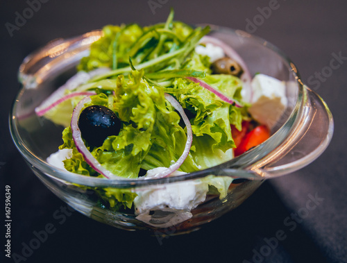 Leaf vegetable salad with olives and cheese feta photo