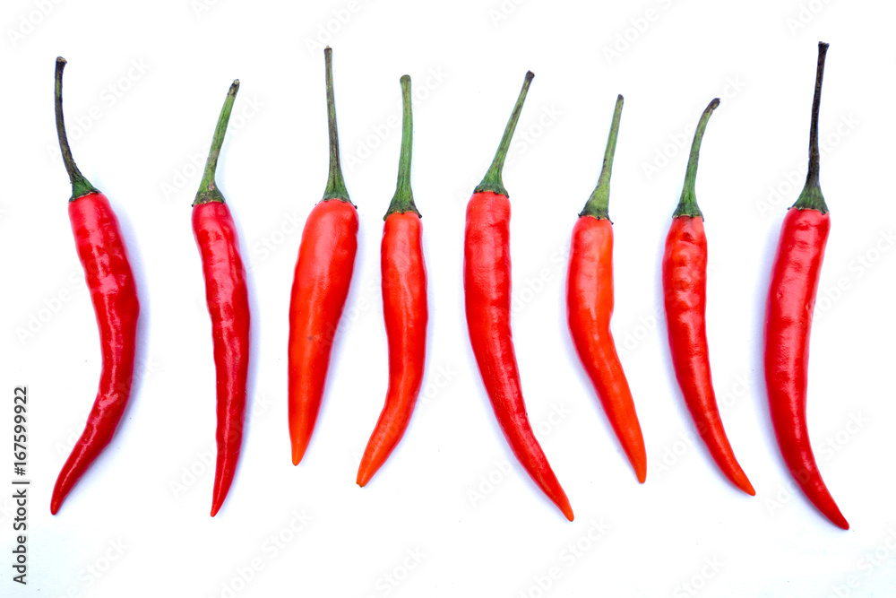 Top view of line composition chilli red peppers isolated on white background