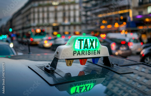 illuminated Parisian Taxi sign.