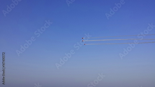 Air show. Airplanes with smoke trails in the sky © abrada