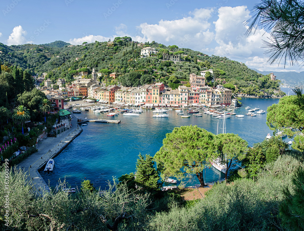 The beautiful Portofino panorama with colorfull houses, boats and yacht in little bay harbor. Liguria, Italy