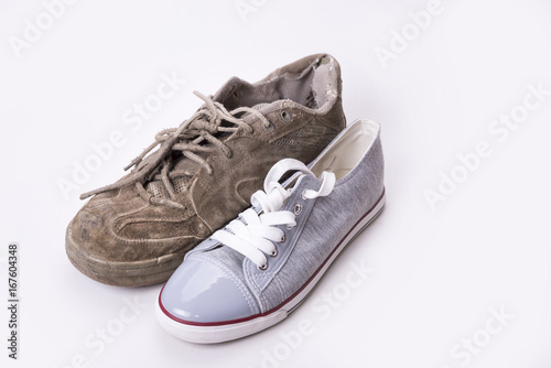 New and old sneaker side by side on white background