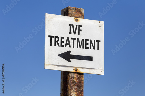 IVF treatment word and arrow signpost