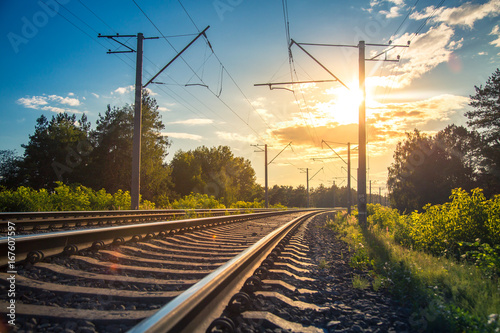 Obraz na plátně Industrial landscape with rails and railway on sunset.