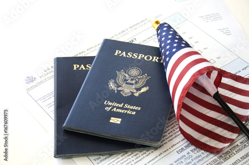 Immigration concept (Passport renewal form, passports and flag) photo