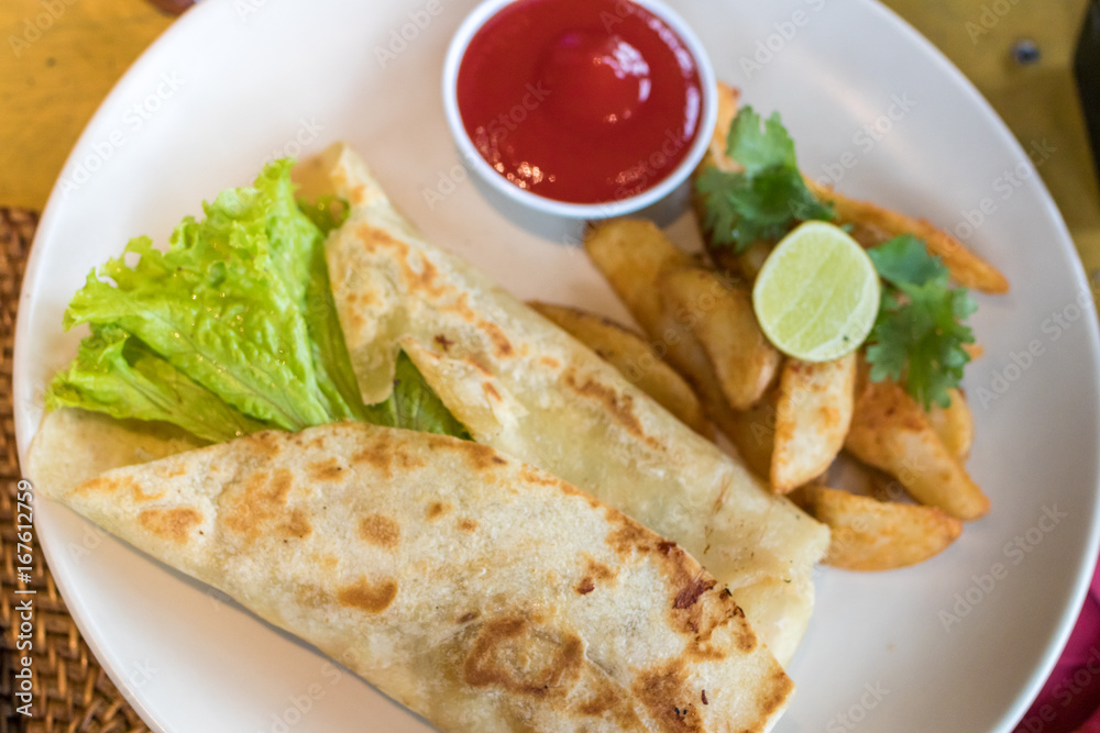 Homemade Quesadilla with chicken in the plate close-up shot, Bali island, Indonesia. Homemade Quesadilla with chicken in the plate close-up shot, Bali island, Indonesia.