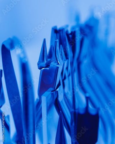 Dental tools on blue background. photo