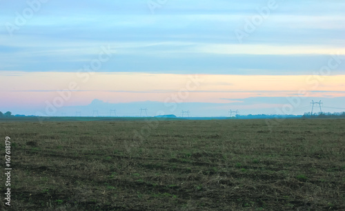 Plowed fertile field with chernozem in the morning