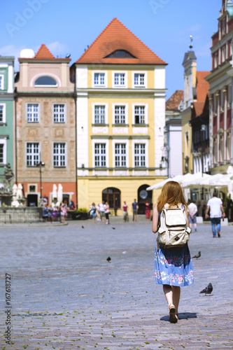 girl walk at the main square Rynek of Poznan
