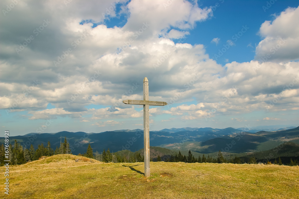Spring landscape in the Carpathian mountains. Cross at top Spring landscape in the Carpathian mountains. Cross at top