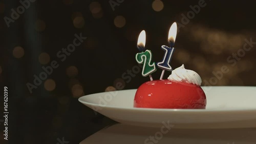 21 birthday or anniversary candle on cake. photo