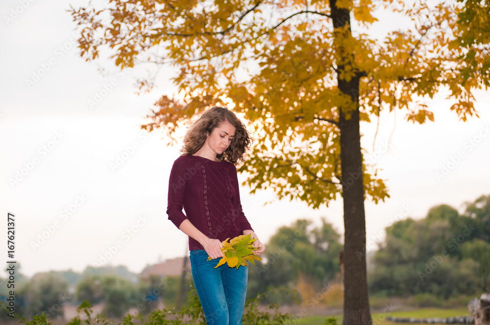 Portrait of young brunette woman in the park Portrait of young brunette woman in the park