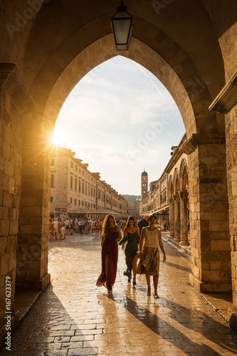 3 girls crossing the East gate of Dubrovnik,  Croatia at sunset