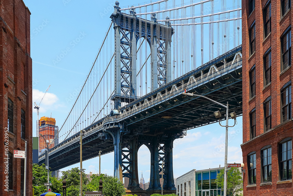 Fototapeta premium Pillar of Manhattan Bridge as seen from Dumbo district in Brooklyn