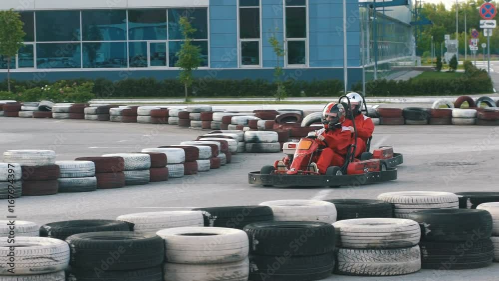 a young couple go karts