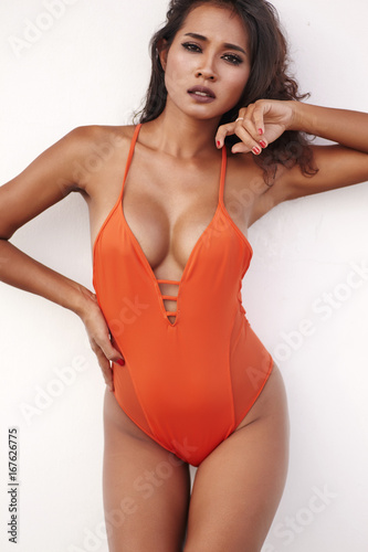 Front view portrait female model in body bikini suit with female torso close up