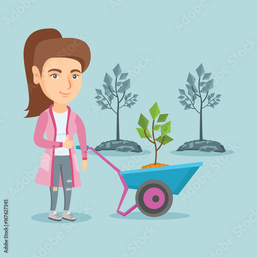 Caucasian gardener standing with wheelbarrow on the background of newly planted trees. Young gardener pushing wheelbarrow with tree and giving thumb up. Vector cartoon illustration. Square layout.