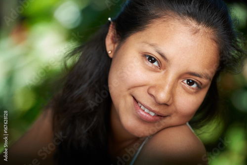 Headshot portrait of young hispanic woman © PixieMe