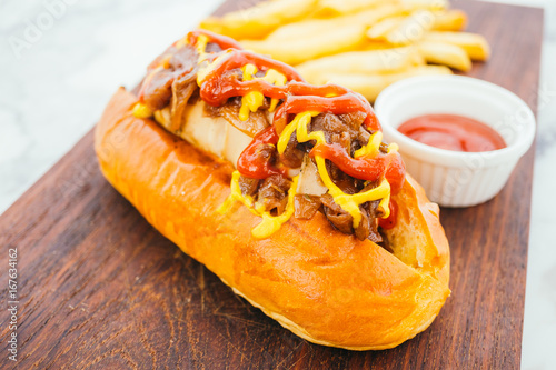 Hotdog with french fries and tomato sauce