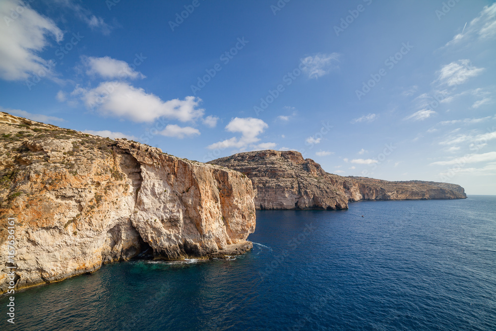 Blue Grotto limestone cliff, majestic nature landmark of Malta island Blue Grotto limestone cliff, majestic nature landmark of Malta island