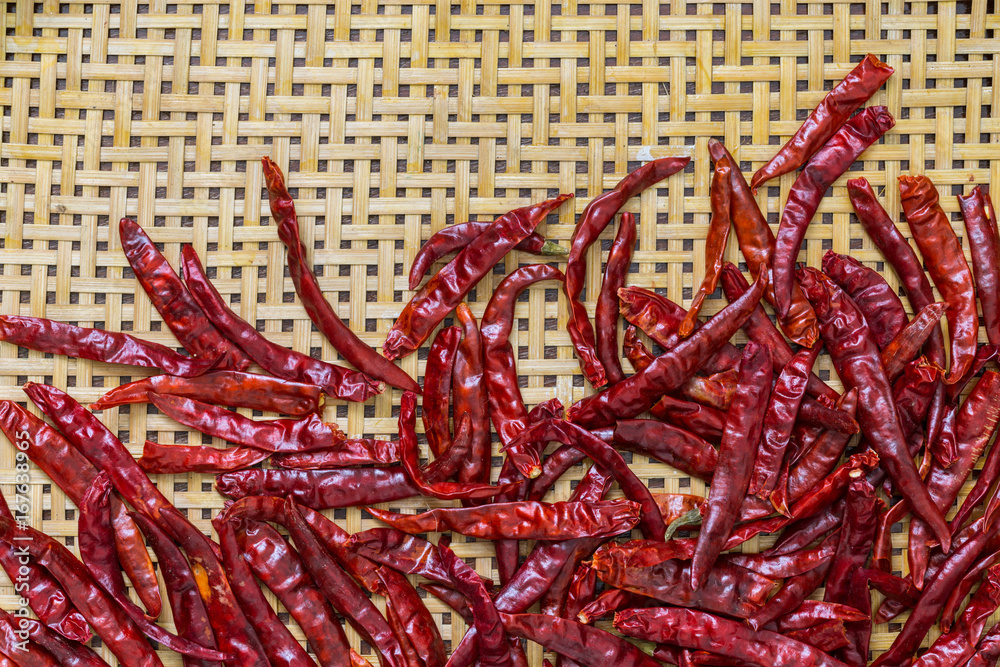 Dried Chillies on bamboo background Dried Chillies on bamboo background