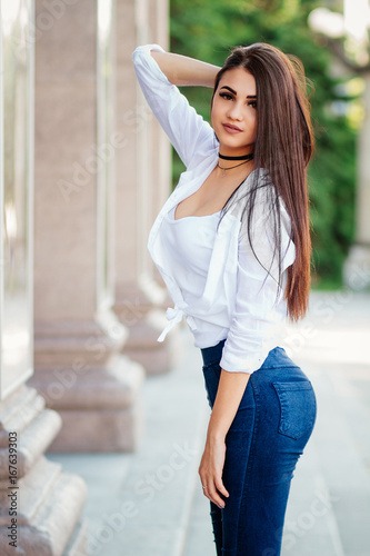 young beautiful brunette girl , street style