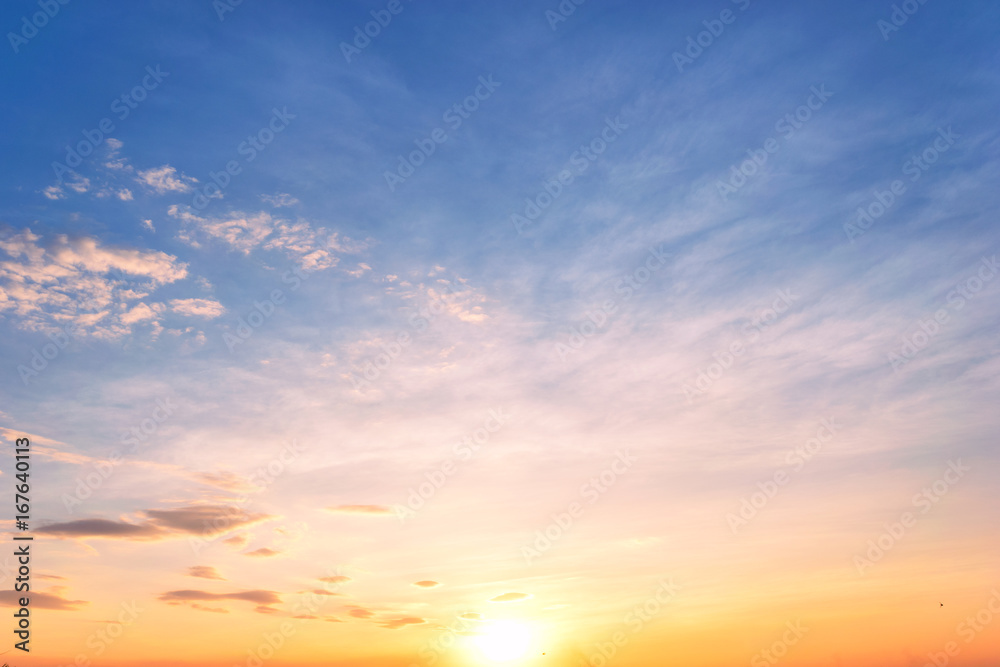Sky background at sunset,Sky blue and orange light of the sun through the  clouds in the sky Stock Photo | Adobe Stock