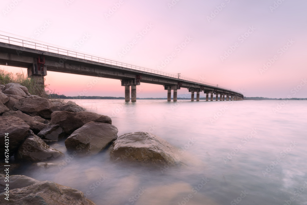 Landscape bridge across the river at sunset train