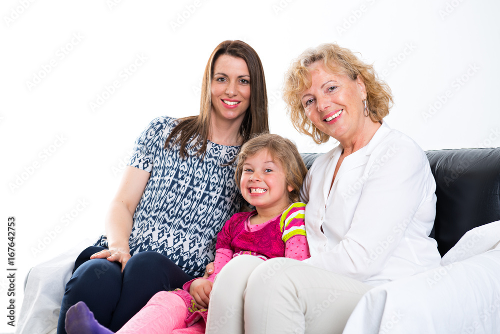 woman with daughter and grandchild  in front of white background