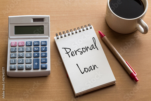 Thinking on Personal Loan, personal finance conceptual - handwriting on notepad with cup of coffee and calculator