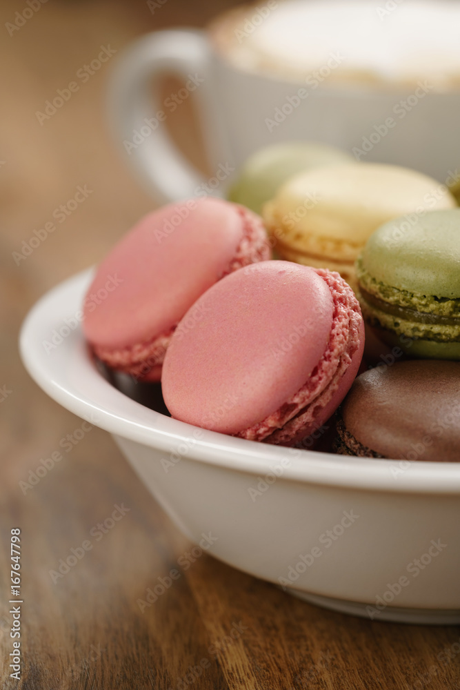 Obraz premium mixed macarons in bowl closeup shot