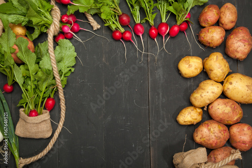 Fresh vegetables on a black wooden background photo