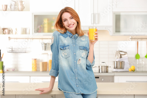 Young woman holding glass o...