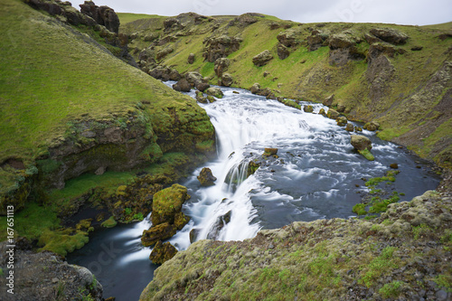 Mountain view of Skogarfoss waterfall, Iceland. © pulpitis17