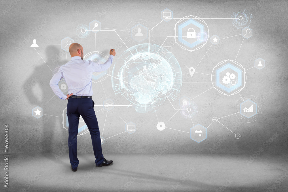 Businessman in front of a wall with an International business network connection displayed on a futuristic interface with technology icon and sphere globe - Worldwide business concept Businessman in front of a wall with an International business network connection displayed on a futuristic interface with technology icon and sphere globe - Worldwide business concept