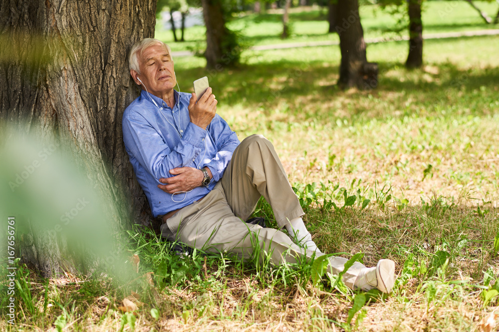 Senior Man Enjoying Weekend in Park Senior Man Enjoying Weekend in Park