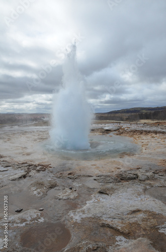 Steaming Strokkur Geyser in a Geothermally Active Area photo