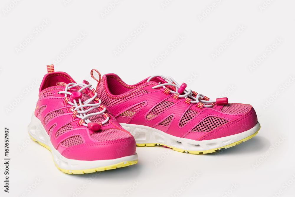 Pink sneakers on a light