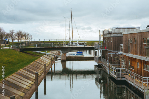 Small boats at Turbinkanalen canal in Malmo, Sweden. Turning Torso building in the background. photo