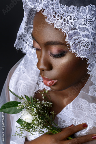 Beautiful african girl with veil hat