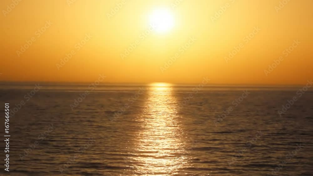 Beautiful orange sunset with the sea in motion Beautiful orange sunset with the sea in motion