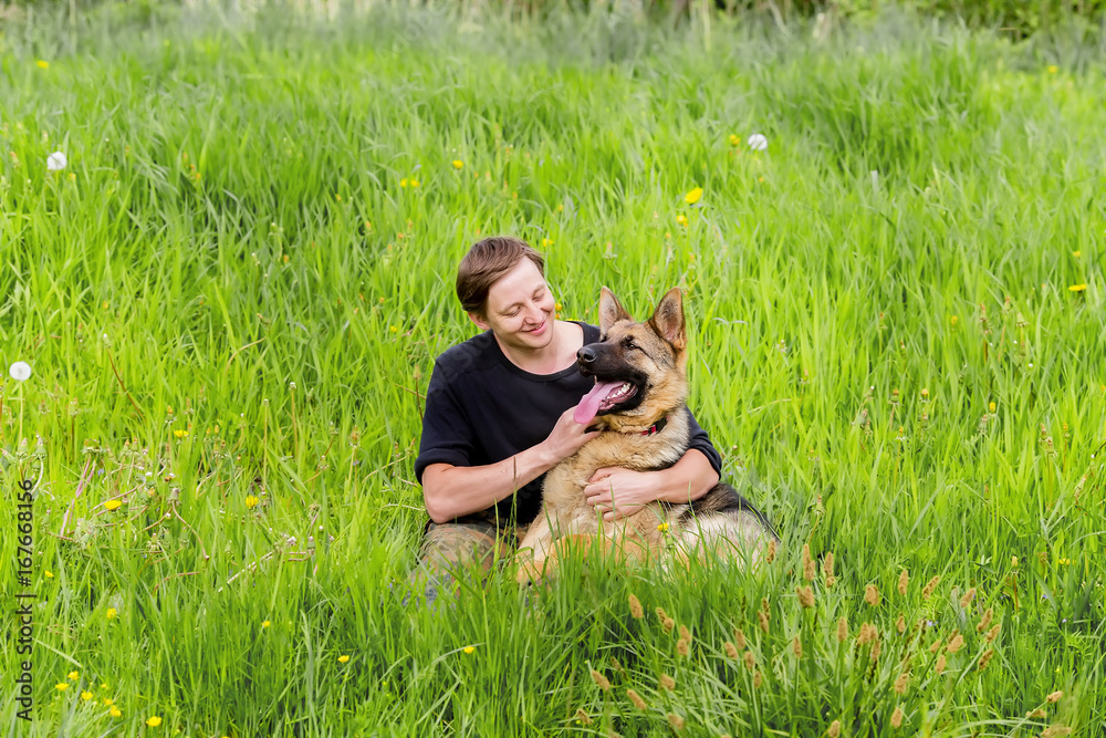 owner looks at his dog. German shepherd Training owner looks at his dog. German shepherd Training