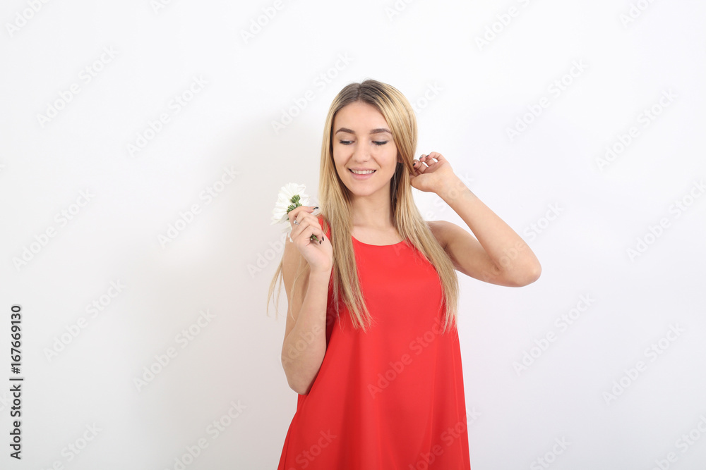 Fashion blonde woman in sexy red dress in the studio. Beauty portrait photo Fashion blonde woman in sexy red dress in the studio. Beauty portrait photo