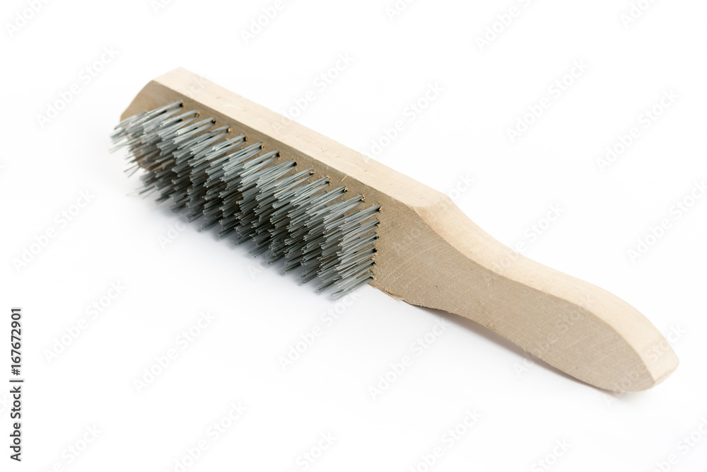 Steel brush hand tool with wooden drunk isolated over white background Steel brush hand tool with wooden drunk isolated over white background