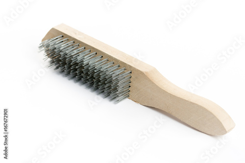 Steel brush hand tool with wooden drunk isolated over white background