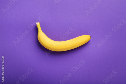 Sweet banana on the purple background