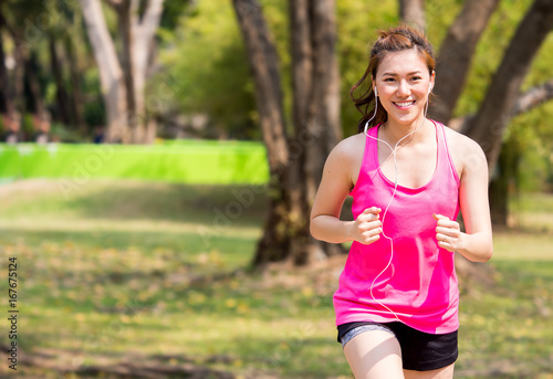 Woman fitness outdoor concept, young asian beautiful woman/sport girl running walking at outdoor park with fresh, relax, happy feeling.