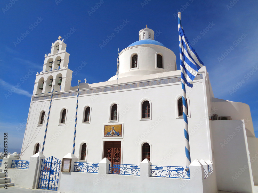 White Colored Church of Panagia of Platsani against Vivid Blue Sky at Oia Village of Santorini Island, Greece 